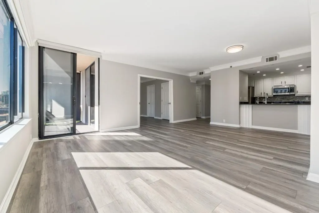 Spacious family room and dining area. Two balconies, new flooring, fresh paint, BRAND new HVAC system