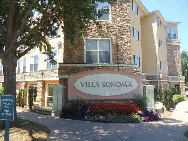Stone facade building with stucco accents