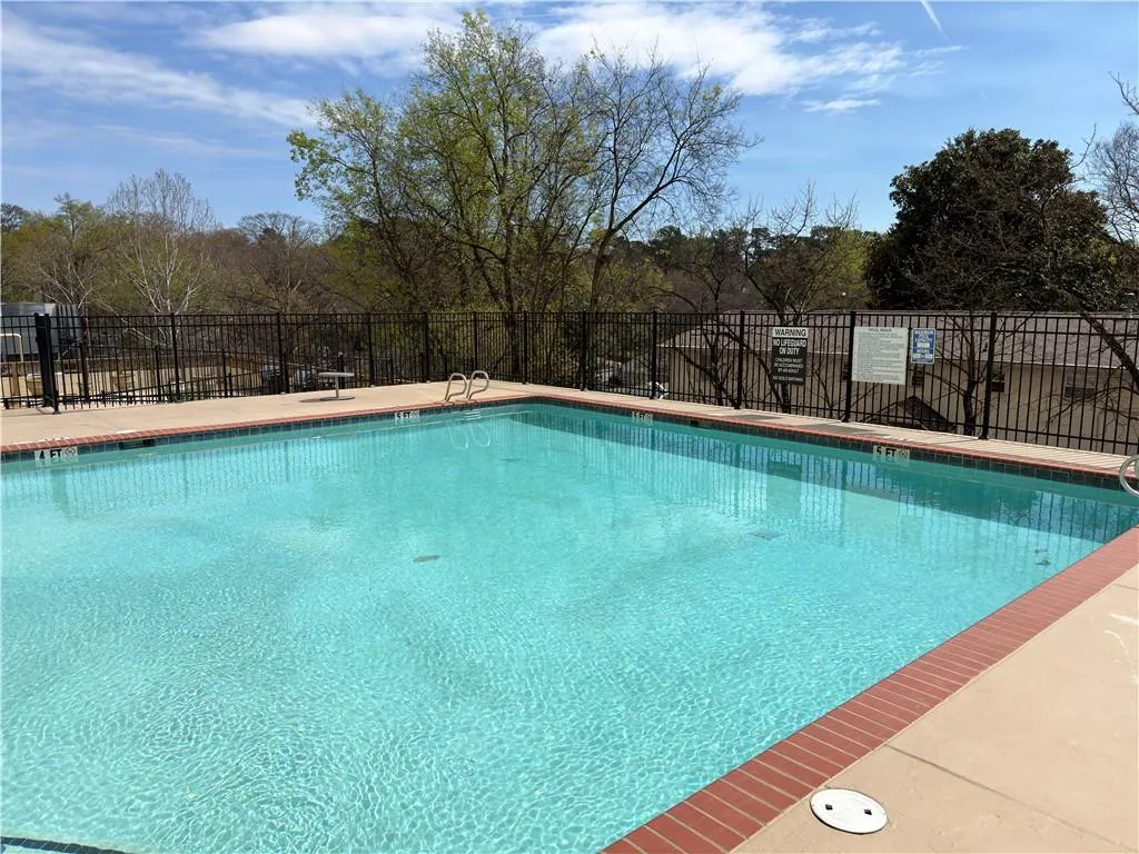 Community pool with a patio area