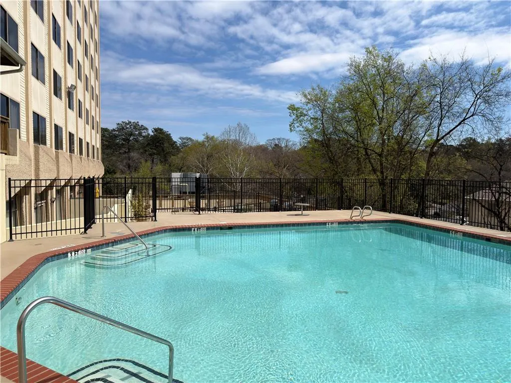Community pool with a patio