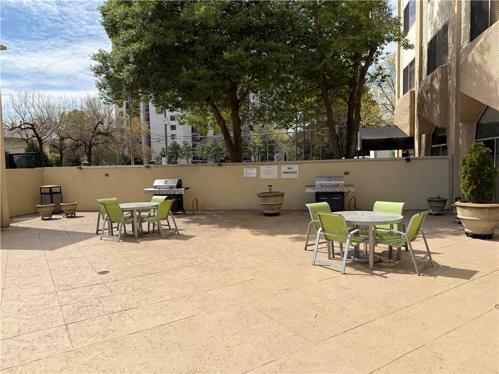 View of patio / terrace with outdoor dining area and a grill