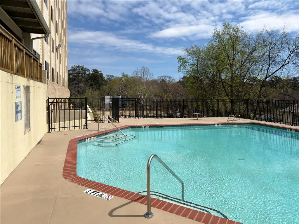 Community pool featuring a patio area