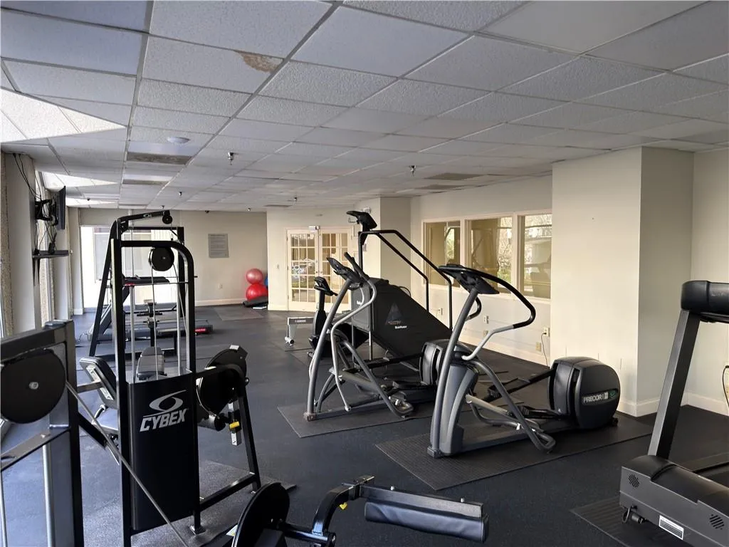 Workout area featuring a paneled ceiling