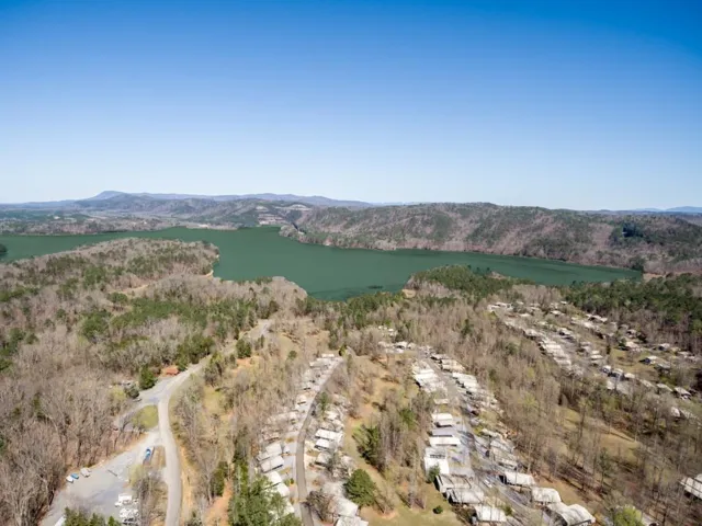Aerial view of a water and mountain view and a heavily wooded area
