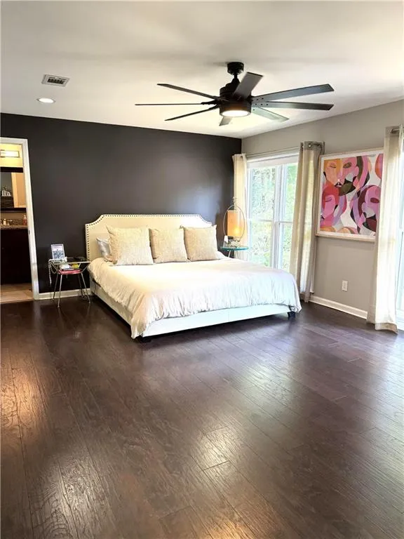 Bedroom featuring ceiling fan and hardwood / wood-style floors