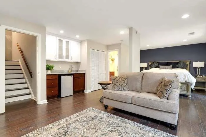 Bedroom featuring a closet and dark hardwood / wood-style floors