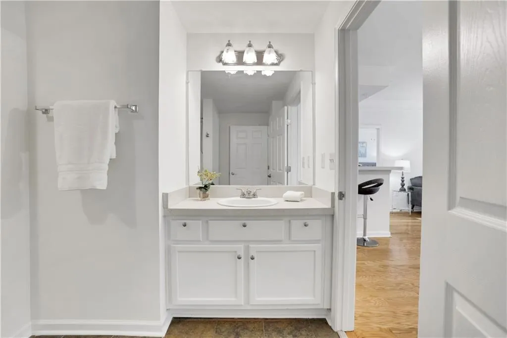 Bathroom with vanity and light wood-style flooring