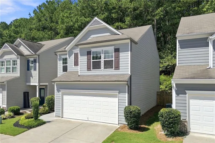 Front of the house with a driveway