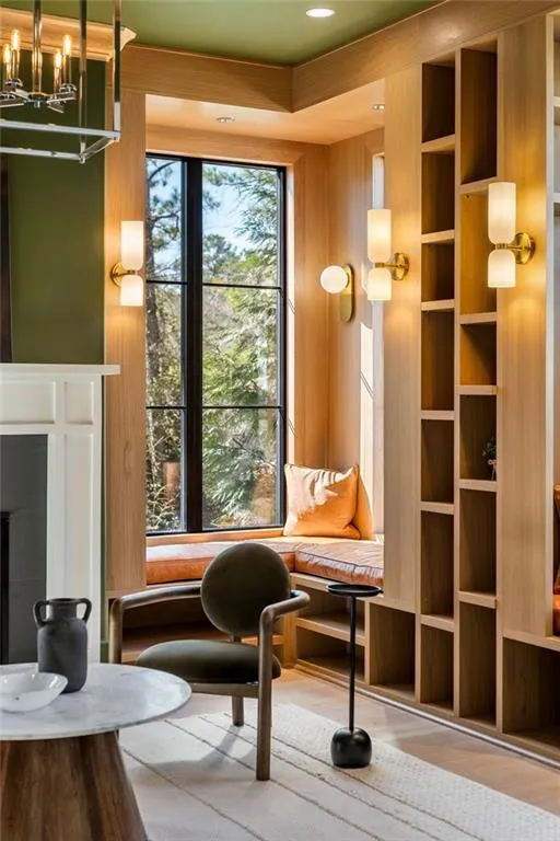 Living area featuring a wealth of natural light and a fireplace