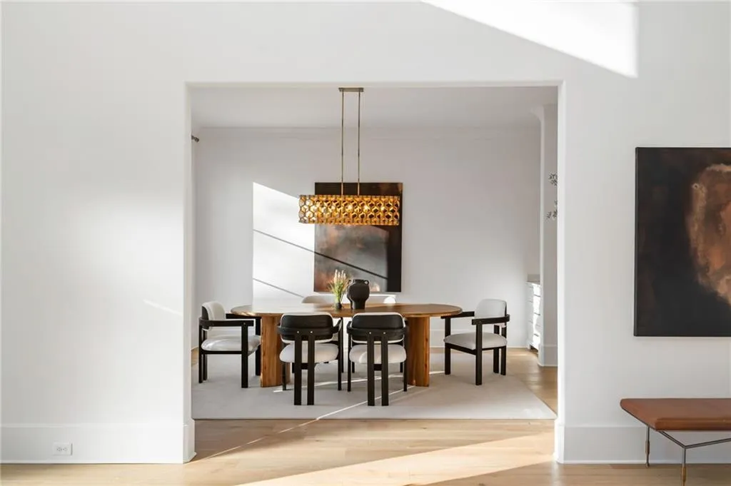 Dining room featuring wood finished floors and baseboards
