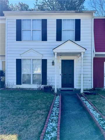 View of front of property with a front lawn