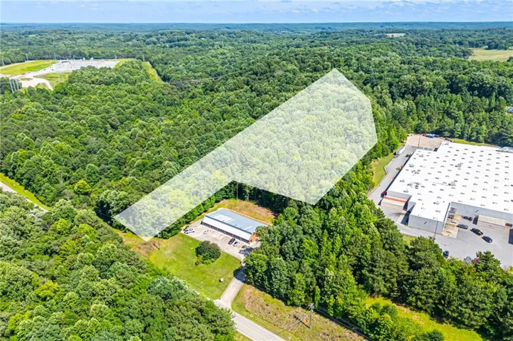 Expansive wooded lot featuring a partial clearing and surrounding dense tree cover