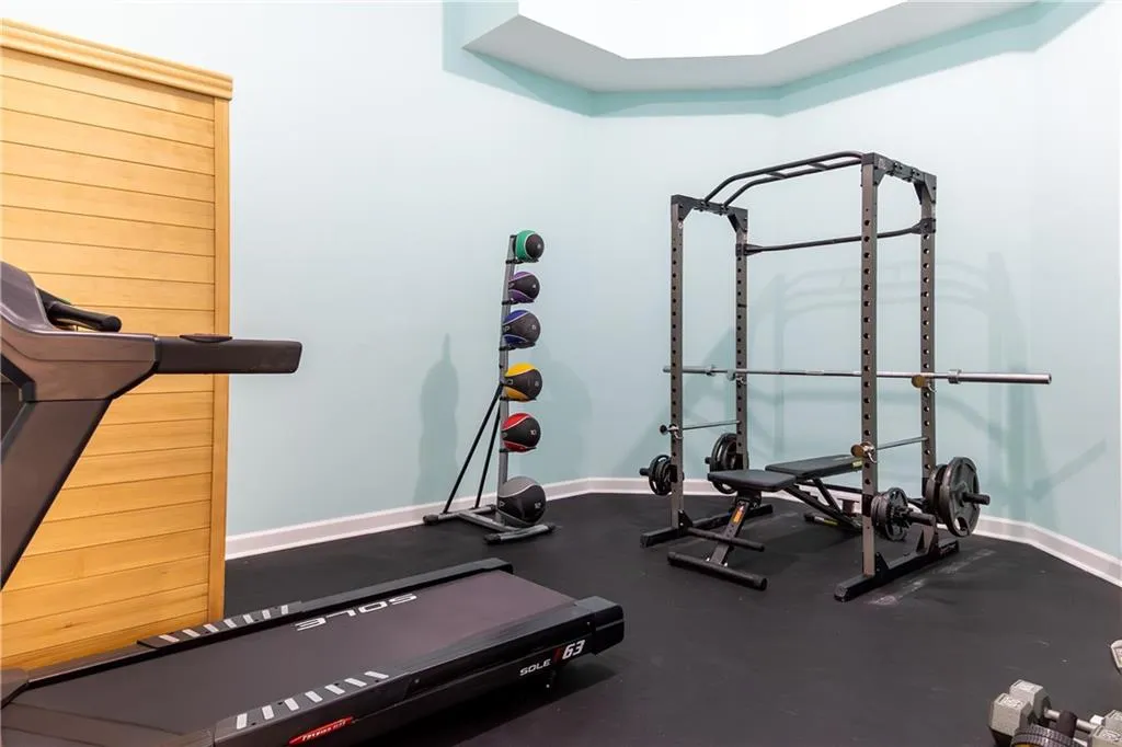 Exercise area featuring baseboards