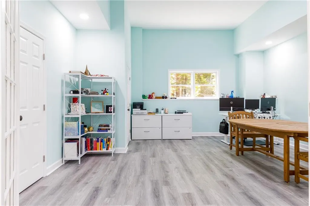 Recreation room with a desk, recessed lighting, and light wood-type flooring