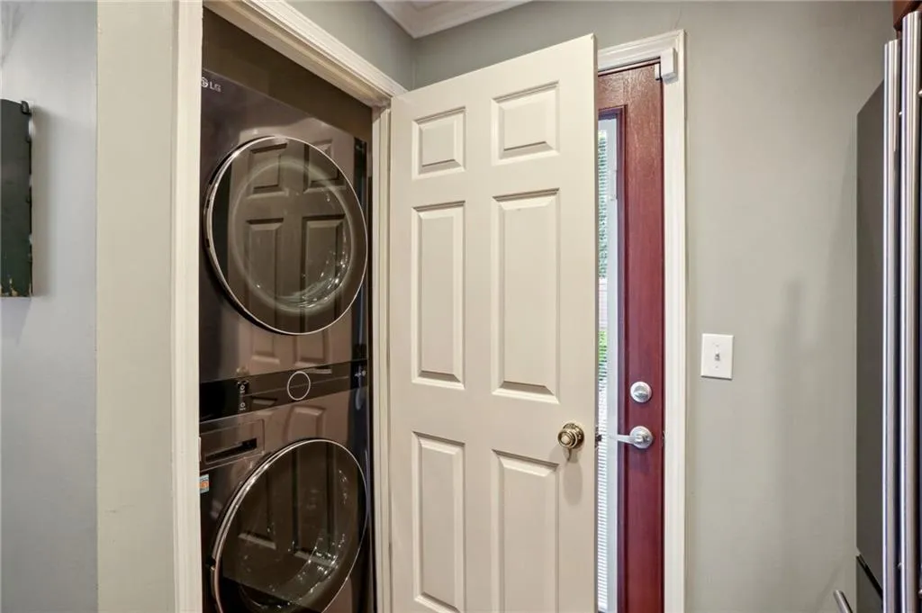 Clothes washing area with stacked washing maching and dryer