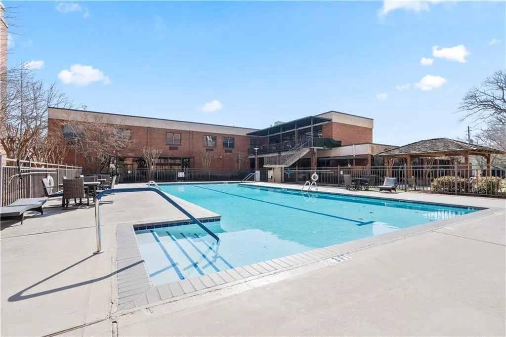 View of pool with a patio area and gazebo