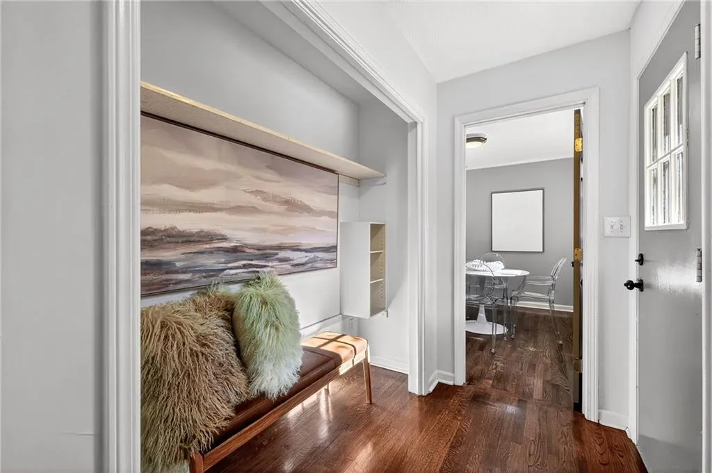 Mud Room | Custom Storage | Friends + Family Door | View to Eat-in Kitchen | Neutral Toned Paint