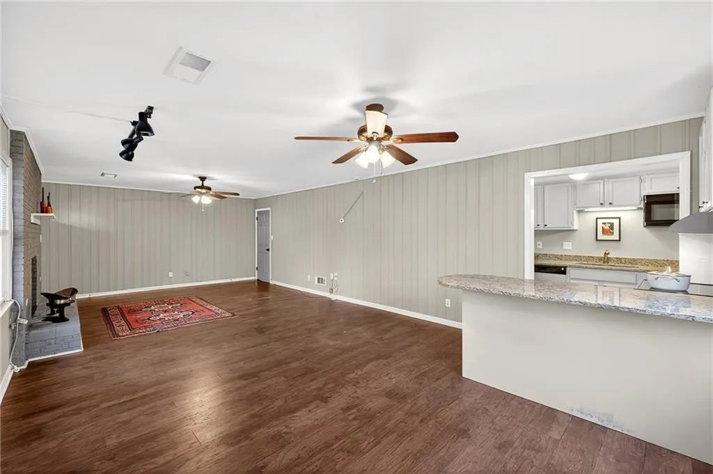 Alternate View of Terrace Level Fireside Family Room | Fully Equipped Kitchen | Stone Countertops | Tongue + Groove Walls