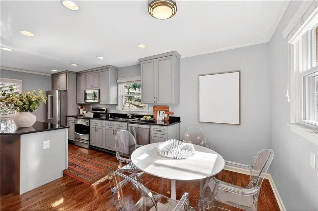 Eat-in Kitchen | Custom Cabinet Design | Gleaming Hardwood Floors | Bright Natural Light | Neutral Toned Paint