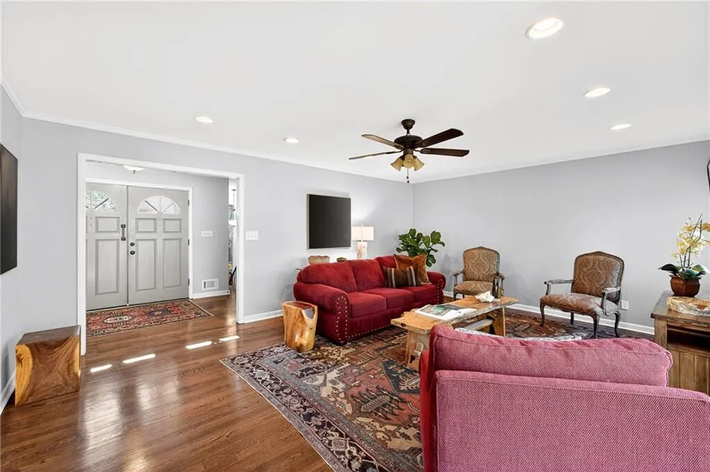View to Entry Foyer | Main Floor Living Room | Gleaming Hardwood Floors | Neutral Paint