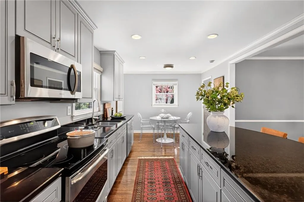 Stainless Steel Appliances | Eat-In Kitchen | Stone Countertops | Dual Pane Vinyl Windows | Custom Painted Cabinetry | Gleaming Hardwood Floors