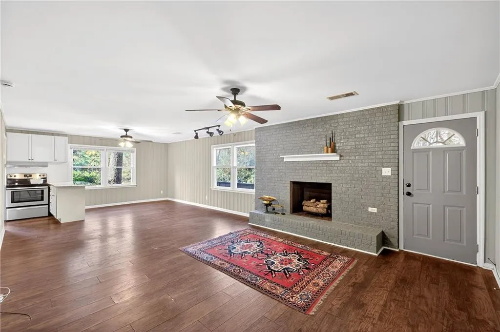 Terrace Level Fireside Family + Dining Room | View to Kitchen | Door to Flagstone Patio