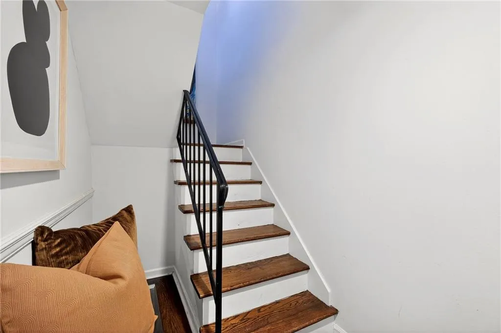 Terrace Level Foyer | Custom Iron Railing | Open Tread Stair | Seating Nook