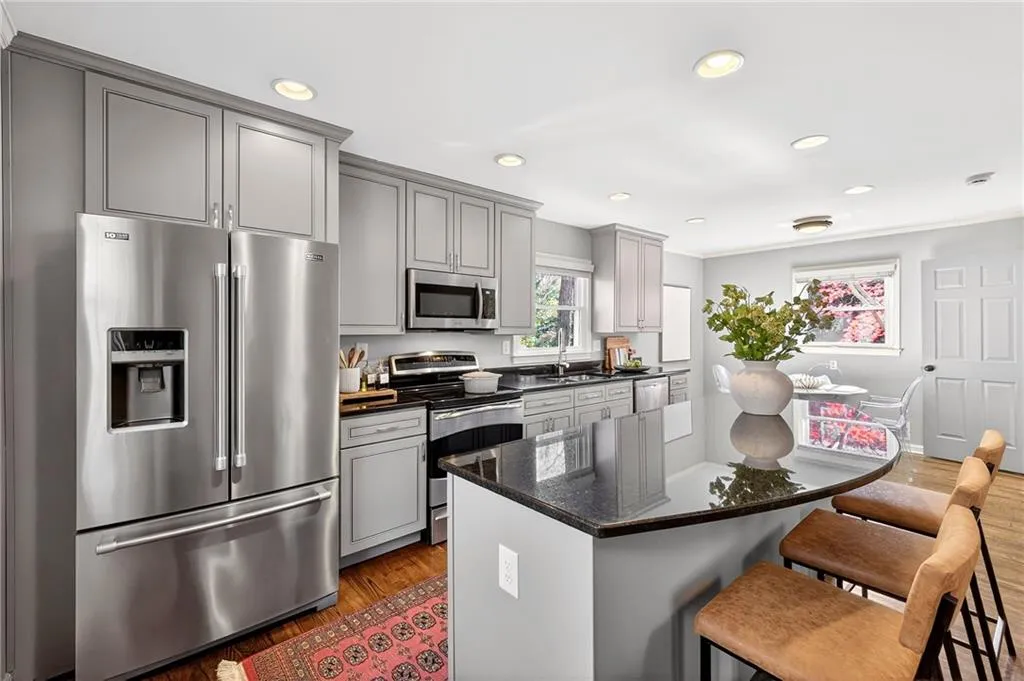 Alternate Kitchen View | Storage Abounds | Custom Cabinets | Island Seating + Storage | Eat-In Kitchen