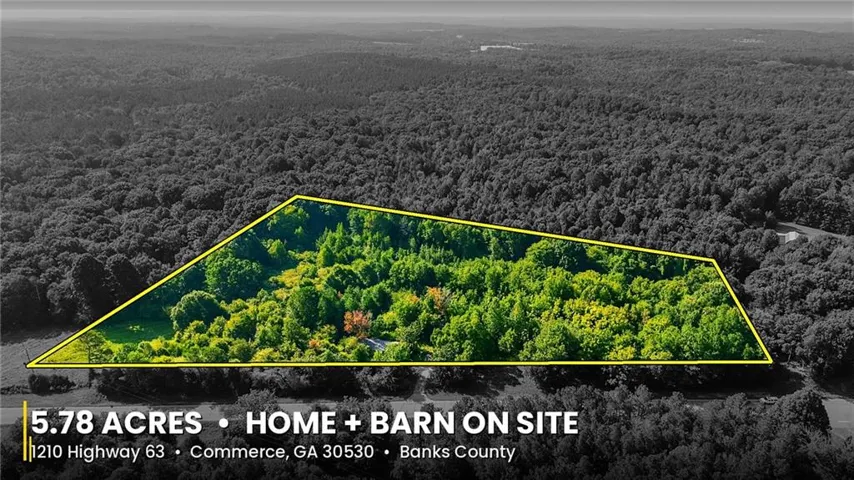 5.78 acres of wooded land with a residential structure and barn on site