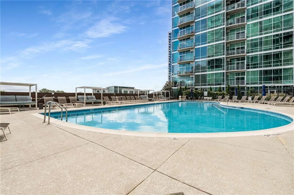 Community pool with a patio area