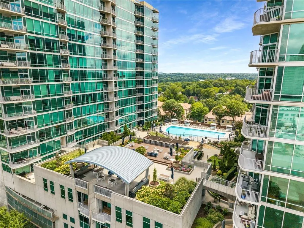 View of apartment building / complex with a community pool
