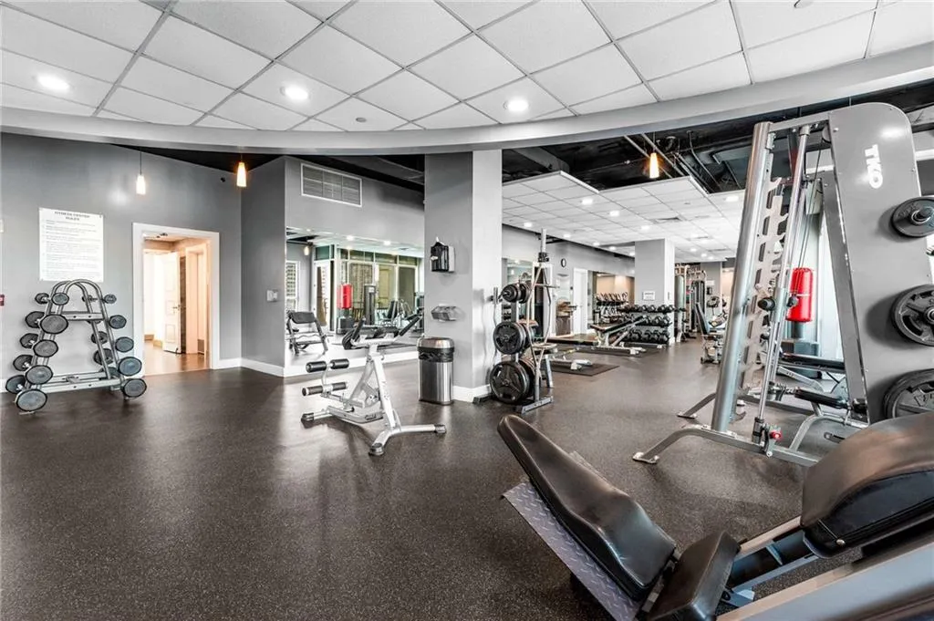 Exercise room featuring a paneled ceiling and recessed lighting