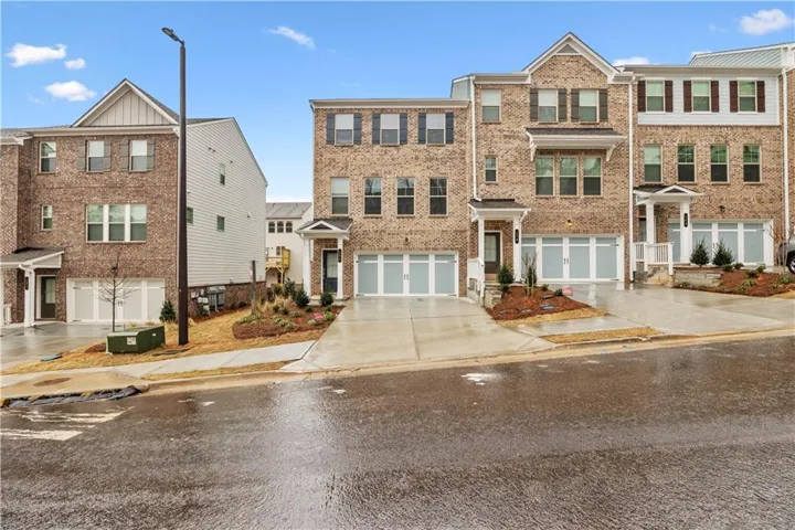 Brick exterior with multi-pane windows and decorative shutters