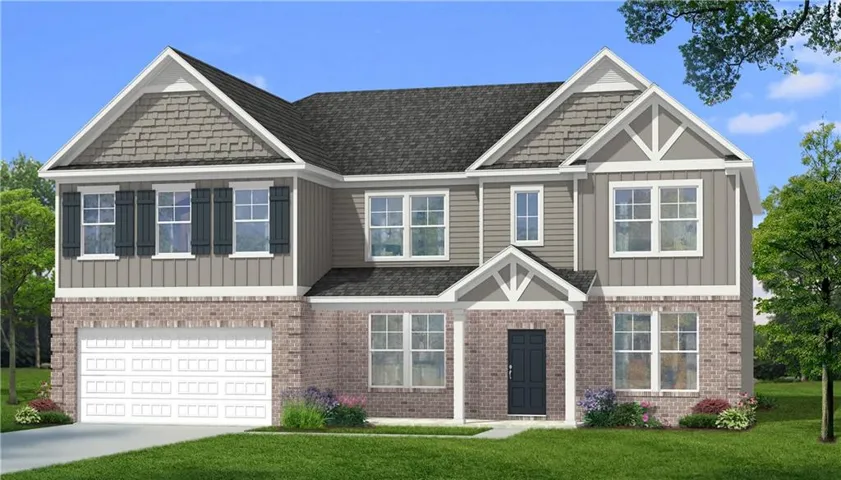 Two-story residence featuring a brick and siding facade with a gabled roofline