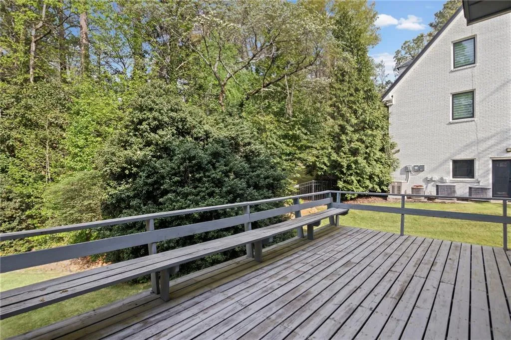 Wood back deck has integrated bench seating