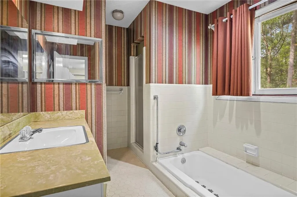 Primary bathroopm has soaking tub and separate shower