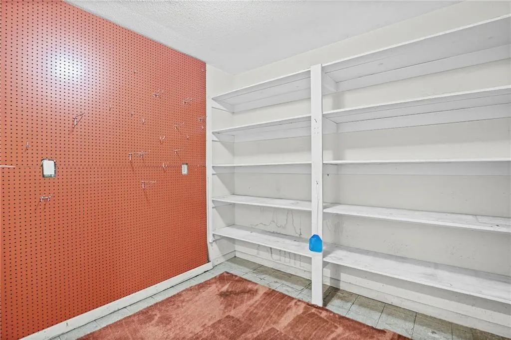 Pantry/ utility closet off of kitchen right by garage