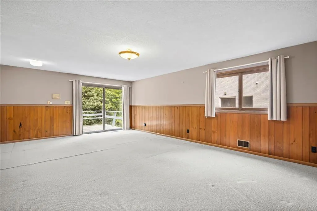 Bonus room on Lower level with sliding glass doors leading to Back deck