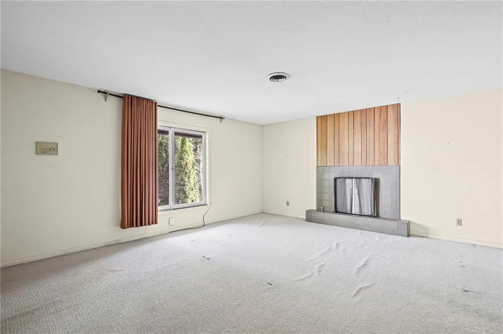 Primary bedroom on upper level has a fireplace