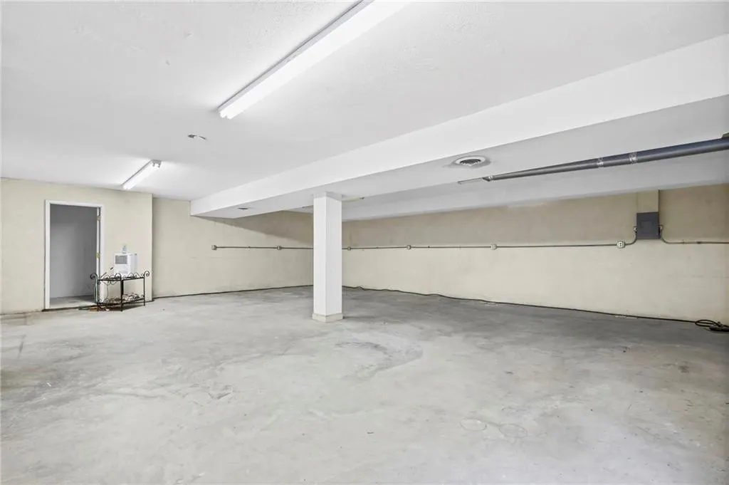 Large Finished basement level has tall ceilings and a vintage wine cellar ( not pictured)