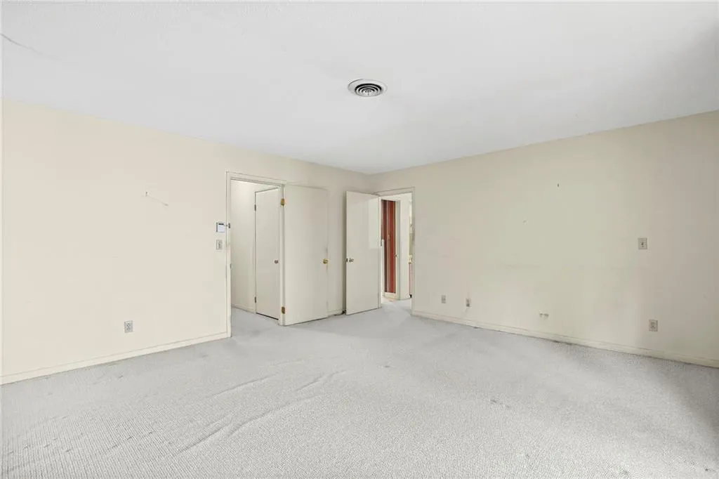 Primary bedroom view to hallway and Primary closet/bathroom