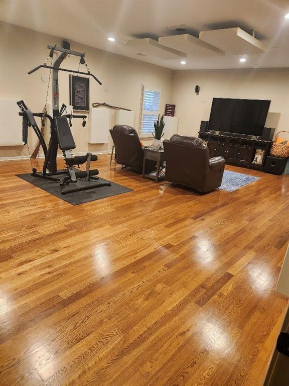 Workout area featuring light hardwood / wood-style flooring