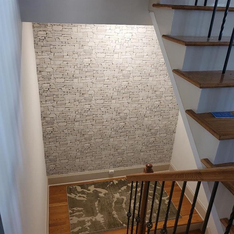 Staircase with wood-type flooring