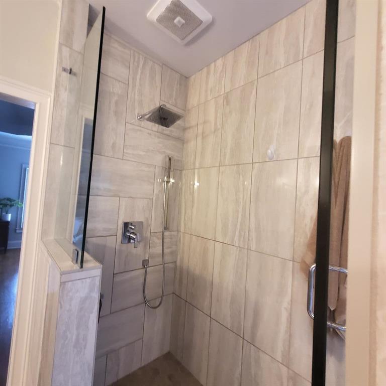 Bathroom with a shower with shower door