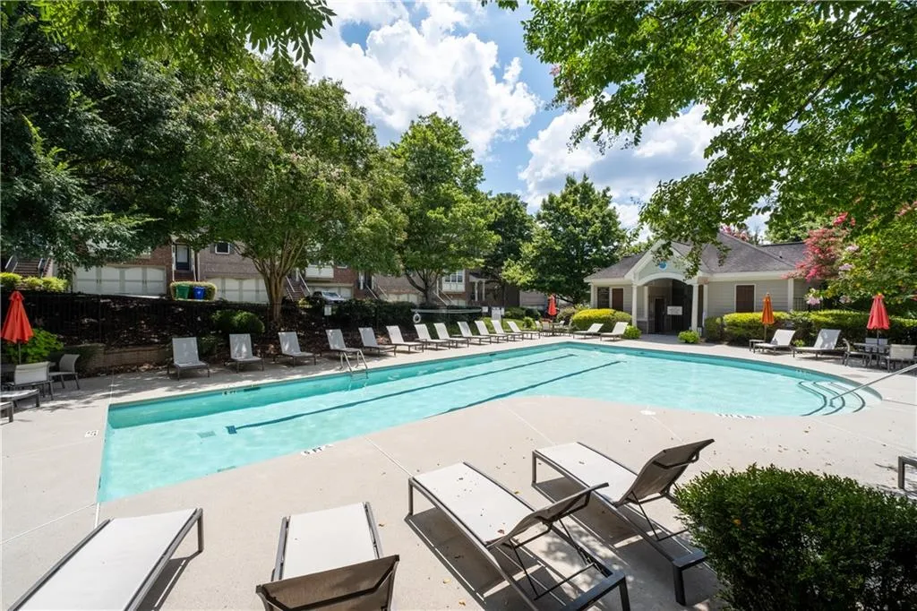 Community pool with a patio