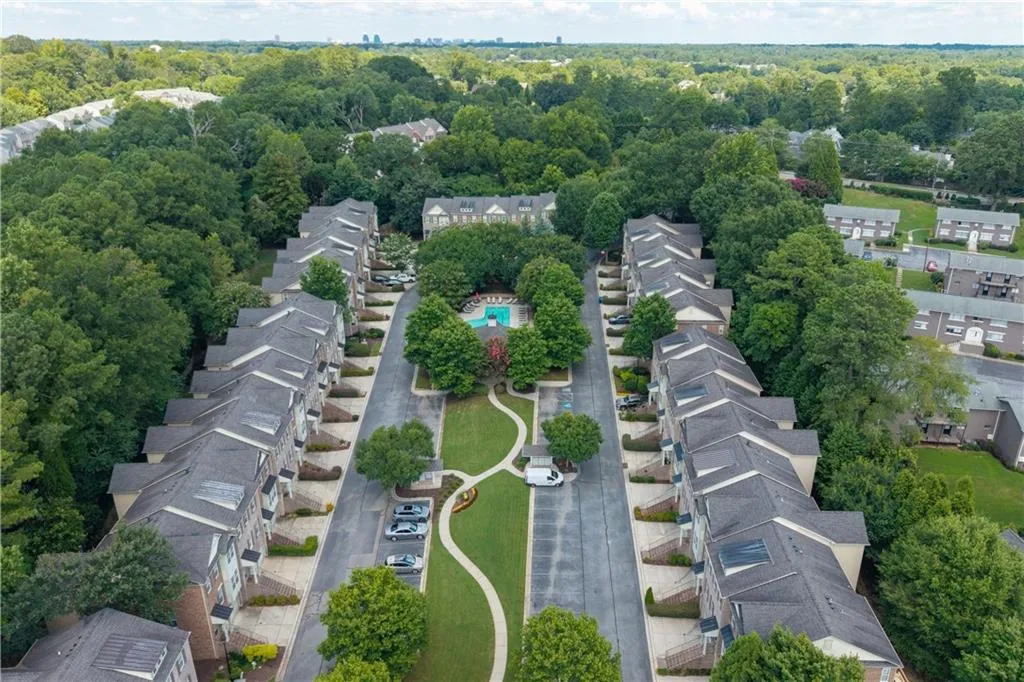 Aerial perspective of suburban area with a heavily wooded area
