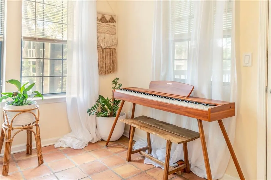 Miscellaneous room featuring a wealth of natural light and light tile patterned floors