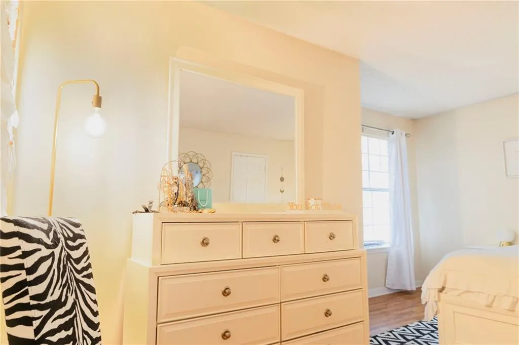 Bedroom with hardwood / wood-style floors