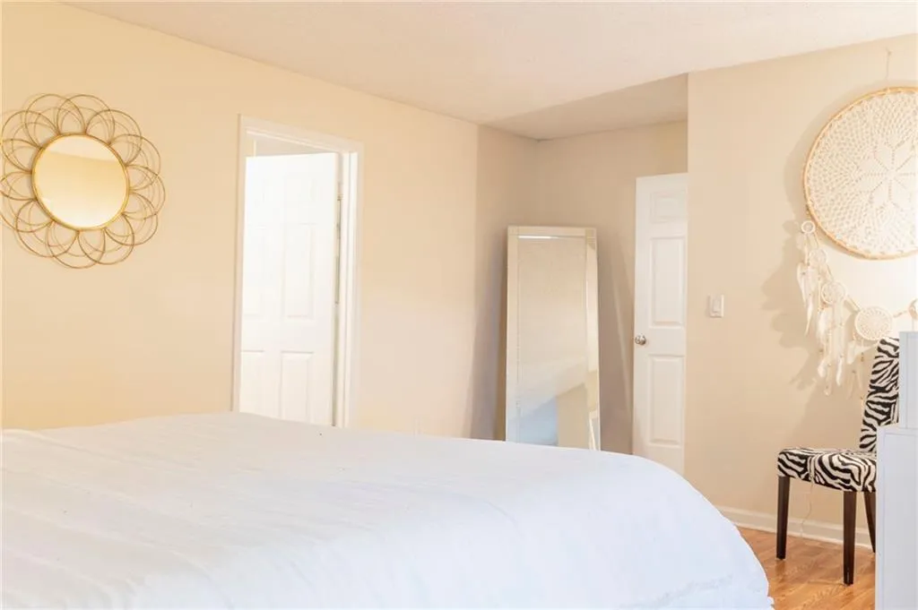 Bedroom with hardwood / wood-style floors