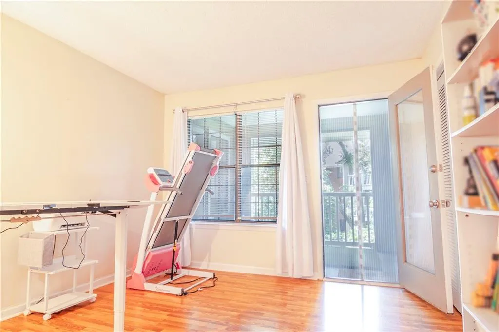 Rec room with hardwood / wood-style flooring